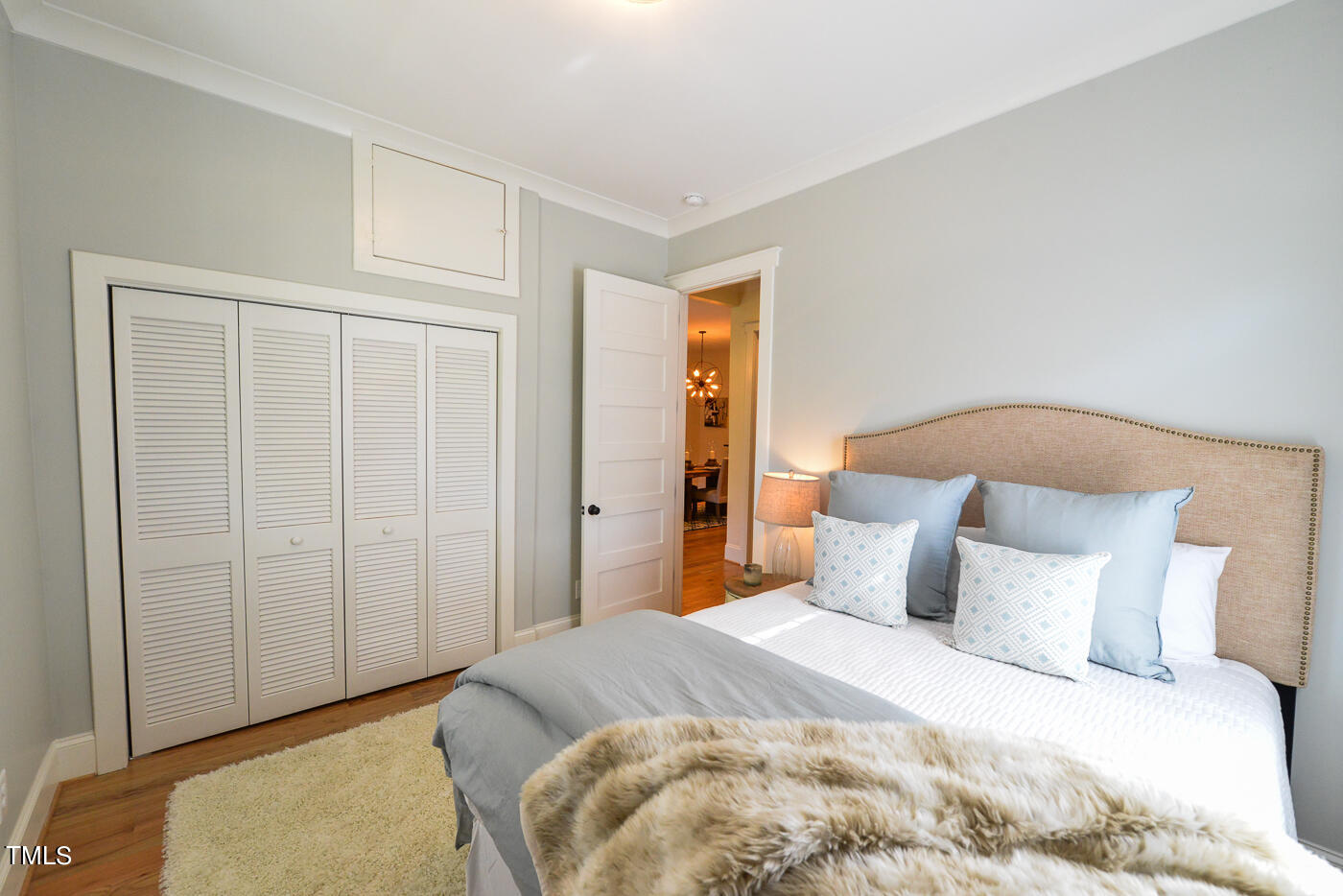 503 Cleveland Street Raleigh, NC 27605 - Photo 13 of 42 a bedroom with a bed and a closet