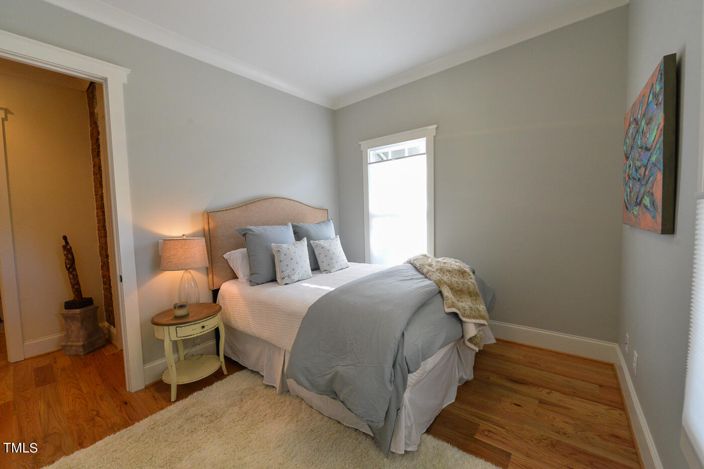 503 Cleveland Street Raleigh, NC 27605 - Photo 14 of 42 a bedroom with a bed and a window