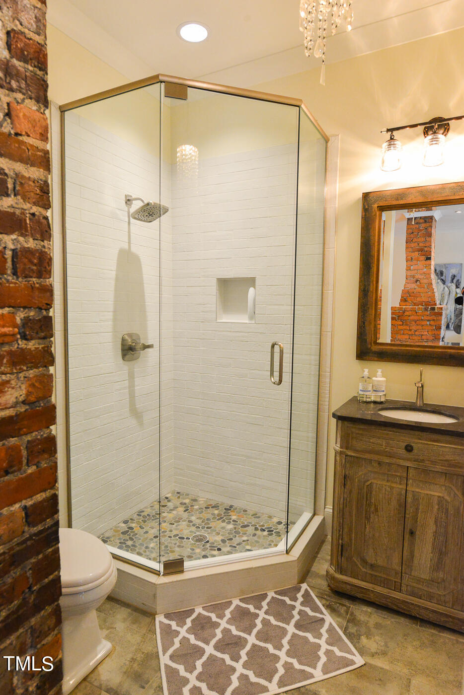 503 Cleveland Street Raleigh, NC 27605 - Photo 17 of 42 a bathroom with a shower a toilet and a sink