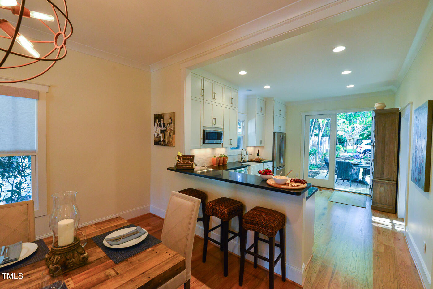 503 Cleveland Street Raleigh, NC 27605 - Photo 26 of 42 a view of a dining room with furniture and wooden floor