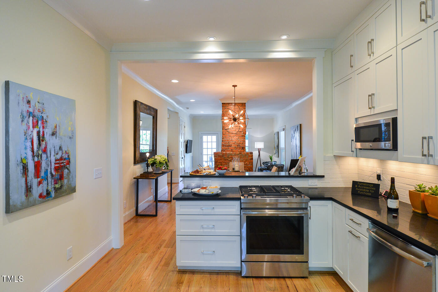 503 Cleveland Street Raleigh, NC 27605 - Photo 30 of 42 a kitchen with stainless steel appliances granite countertop a stove and a sink