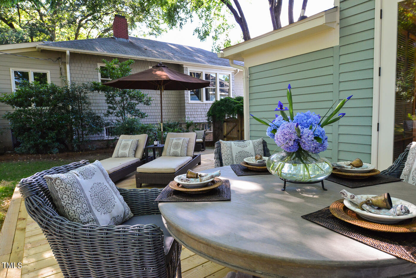 503 Cleveland Street Raleigh, NC 27605 - Photo 37 of 42 a view of a patio with couches chairs and a potted plant