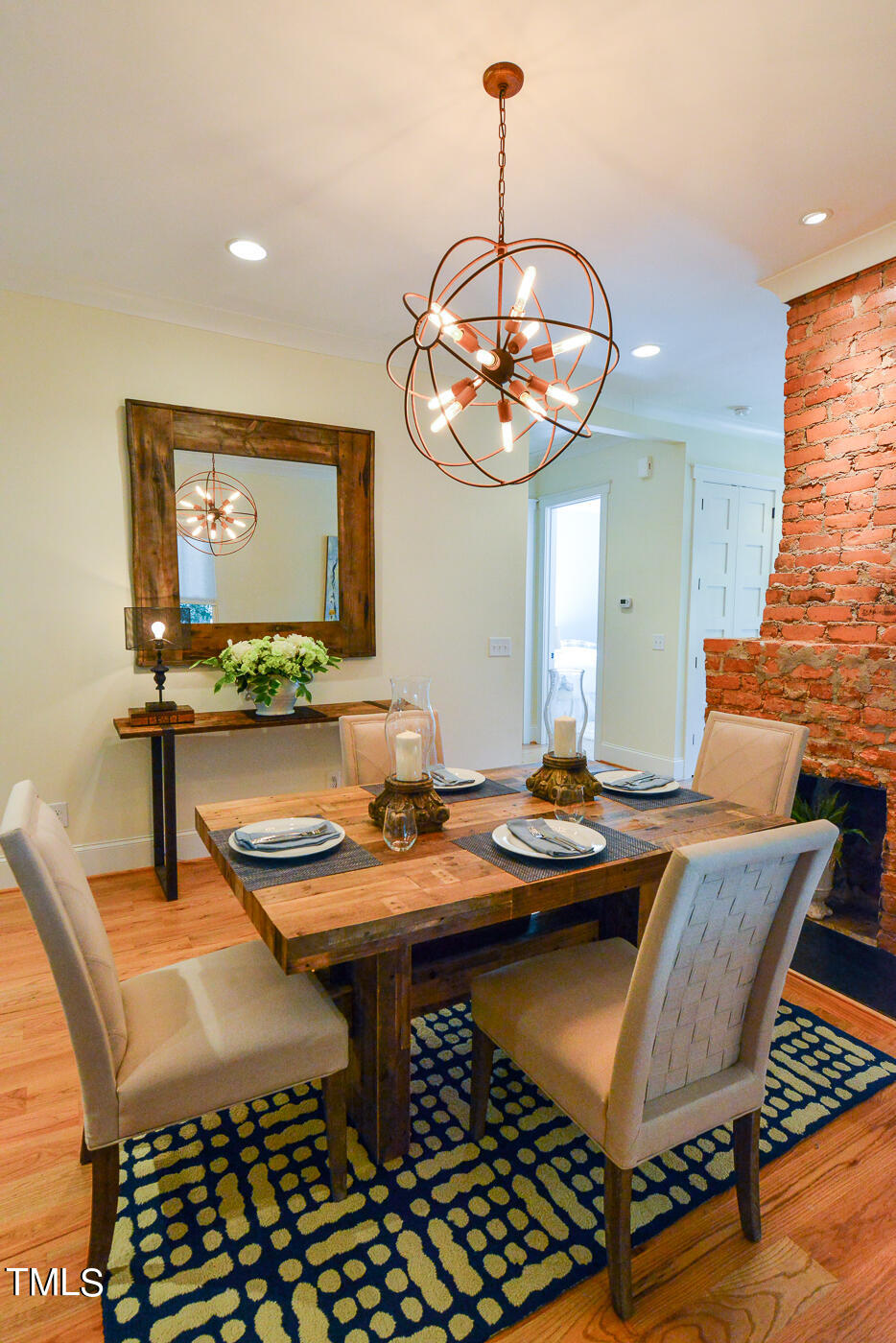 503 Cleveland Street Raleigh, NC 27605 - Photo 10 of 42 a view of a dining room with furniture wooden floor and chandelier