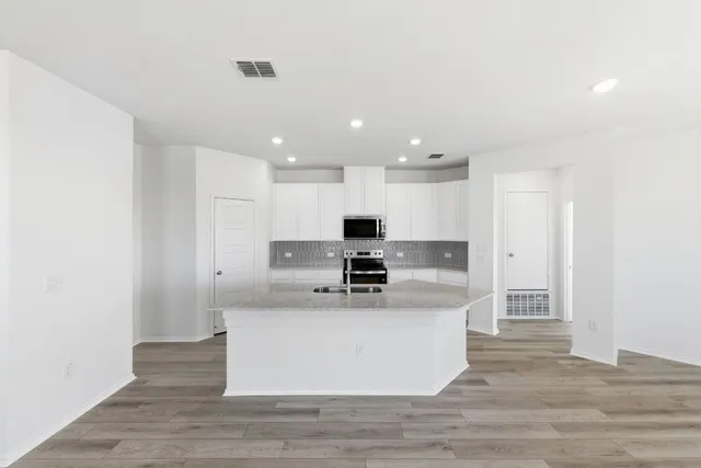 a kitchen with sink and window