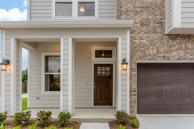 a front view of a house with a glass windows