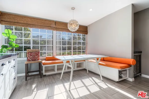 a outdoor space with pool table and chairs