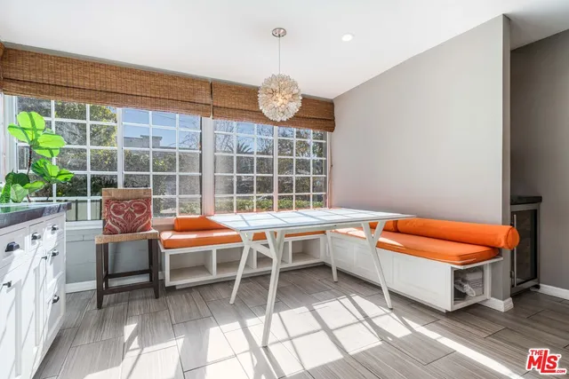 a outdoor space with pool table and chairs