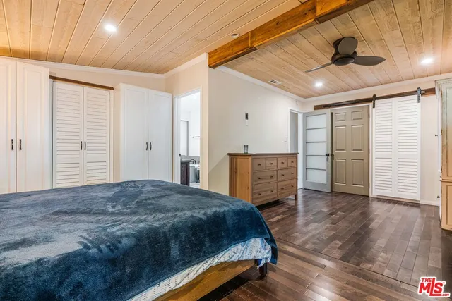 a bedroom with a bed and a walk in closet