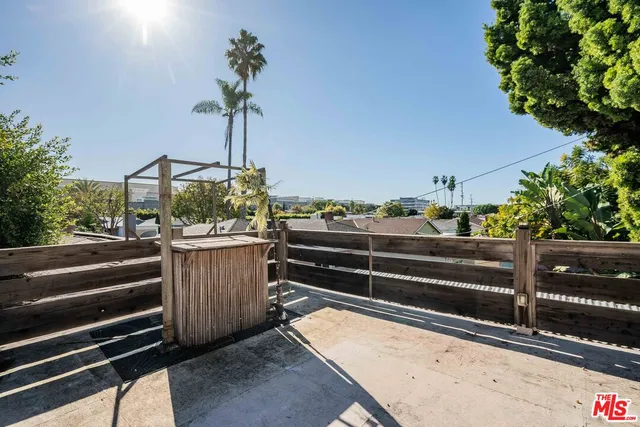 a bedroom with double bed and a window