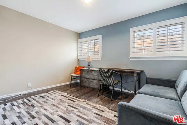 a bathroom with a sink vanity and shower