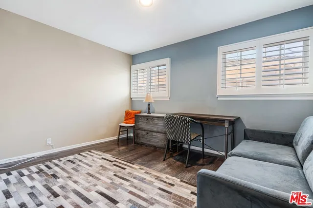 a bathroom with a sink vanity and shower