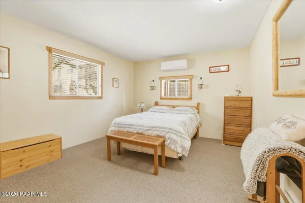 a bedroom with a bed and a closet