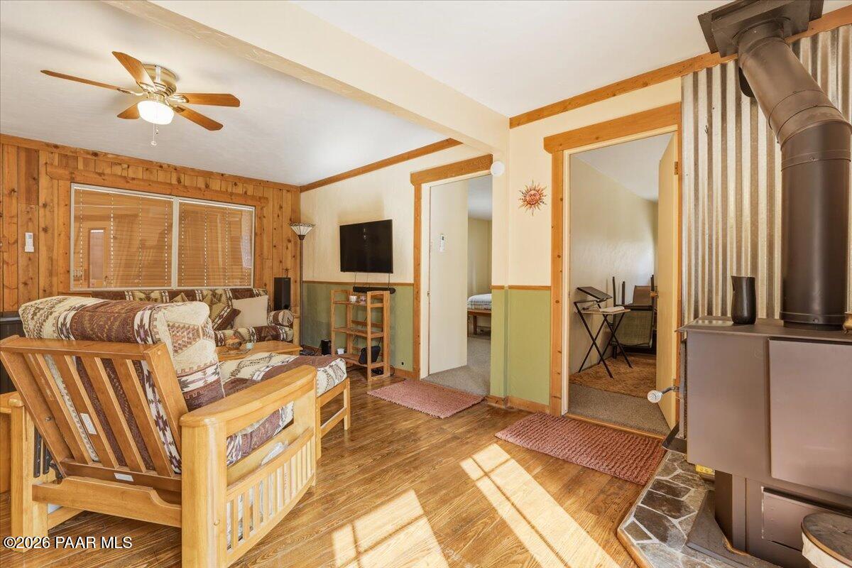 1383 West Boulder Road Prescott, AZ 86303 - Photo 6 of 21 a living room with furniture a fireplace and a flat screen tv
