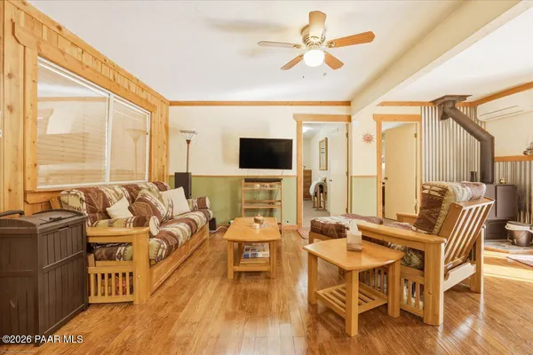 a living room with furniture fireplace and a flat screen tv