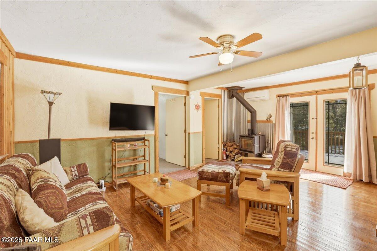 1383 West Boulder Road Prescott, AZ 86303 - Photo 8 of 21 a living room with furniture and a flat screen tv