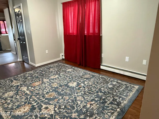 a view of a room with large mirror and closet