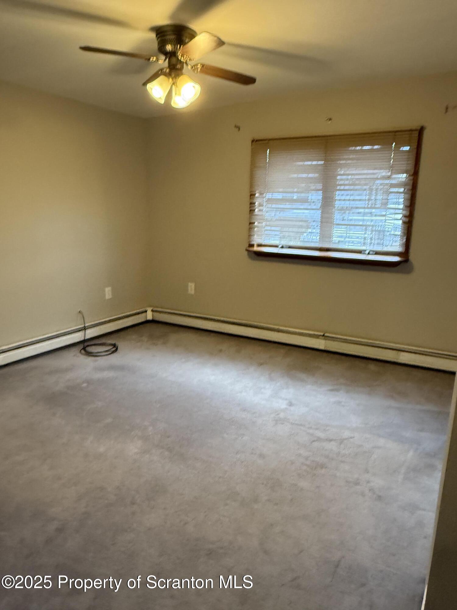 319 Green Street Scranton, PA 18508 - Photo 7 of 8 an empty room with a window