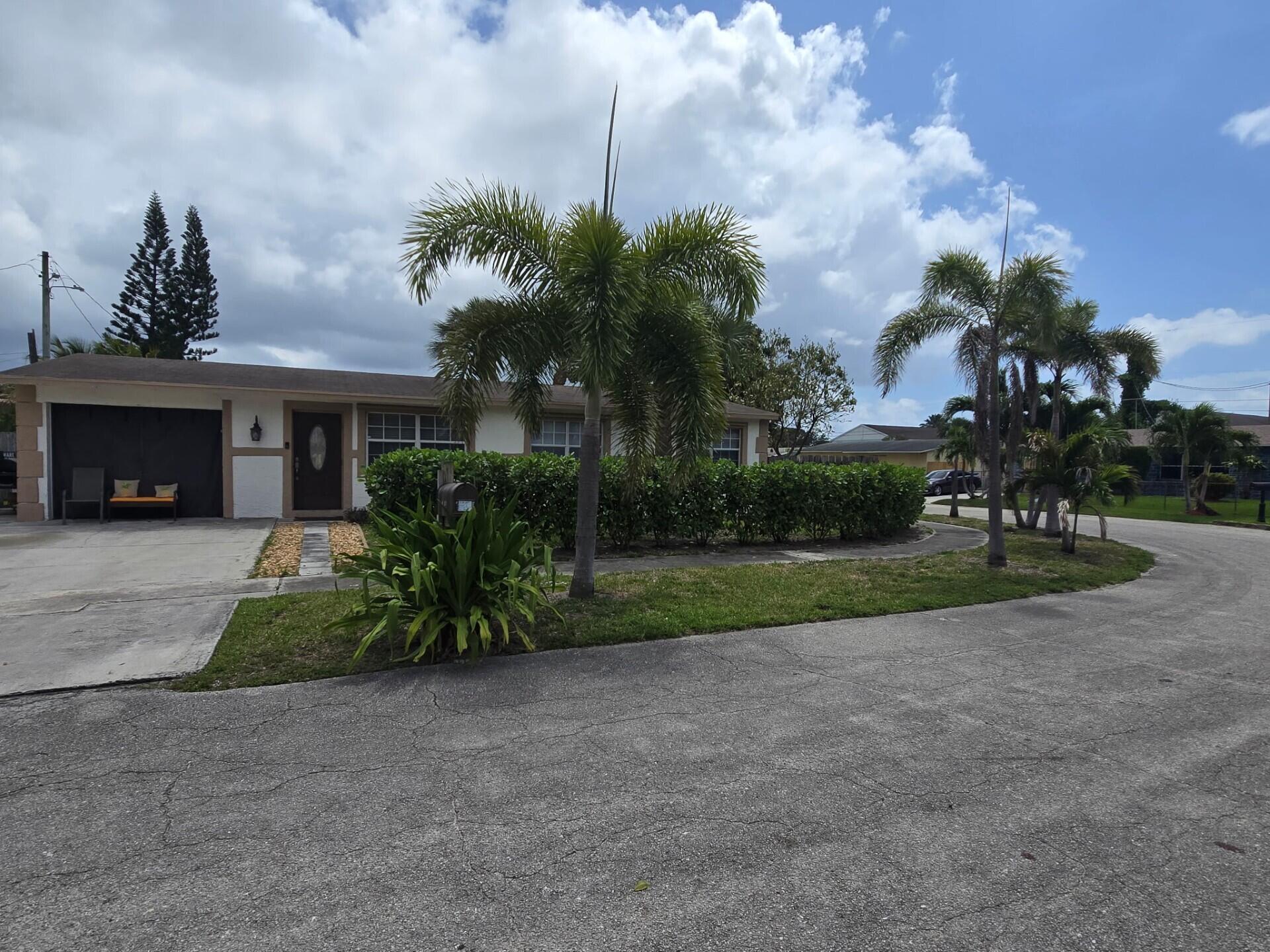 1530 Pine Tree Court Riviera Beach, FL 33404 - Photo 1 of 21 Corner Lot