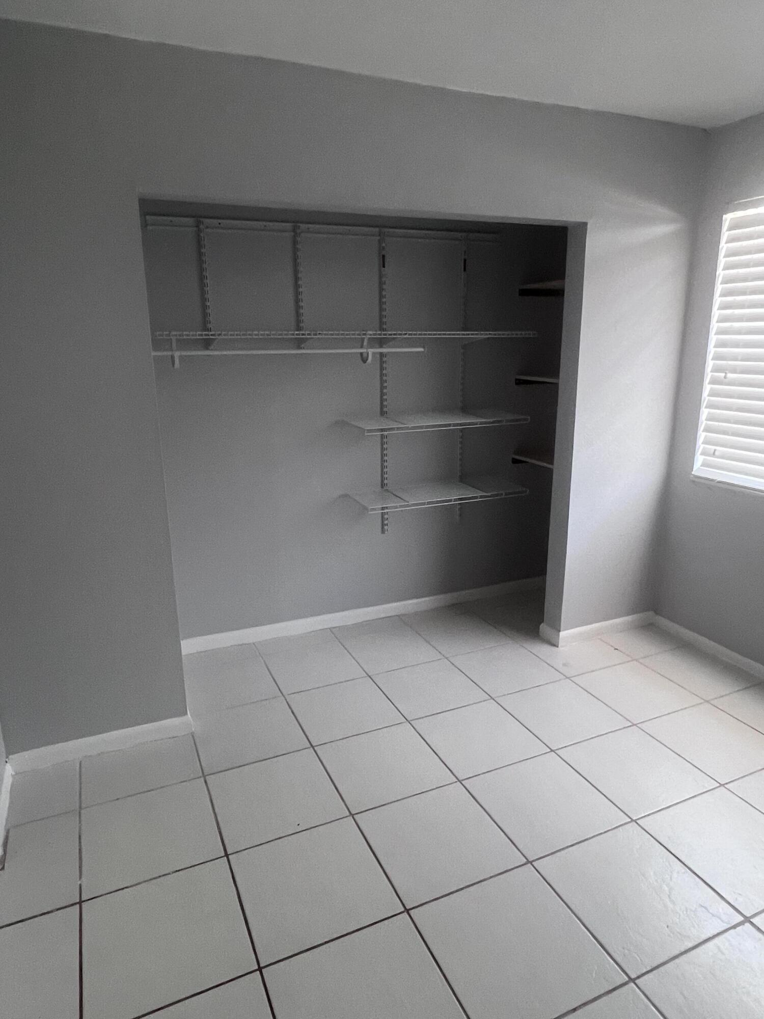 1530 Pine Tree Court Riviera Beach, FL 33404 - Photo 13 of 21 Guest Bedroom