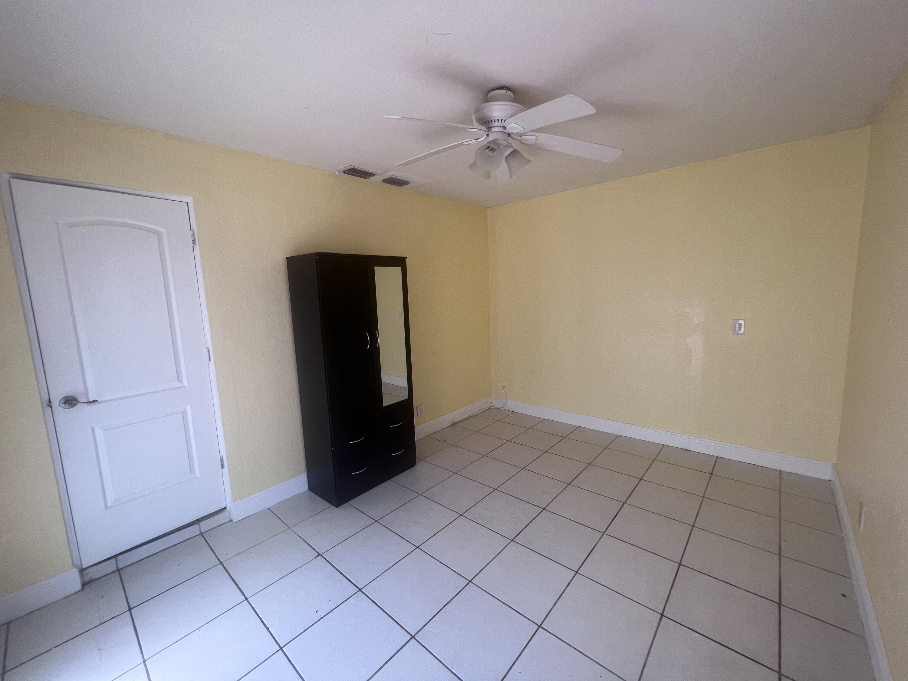 1530 Pine Tree Court Riviera Beach, FL 33404 - Photo 14 of 21 Guest Bedroom