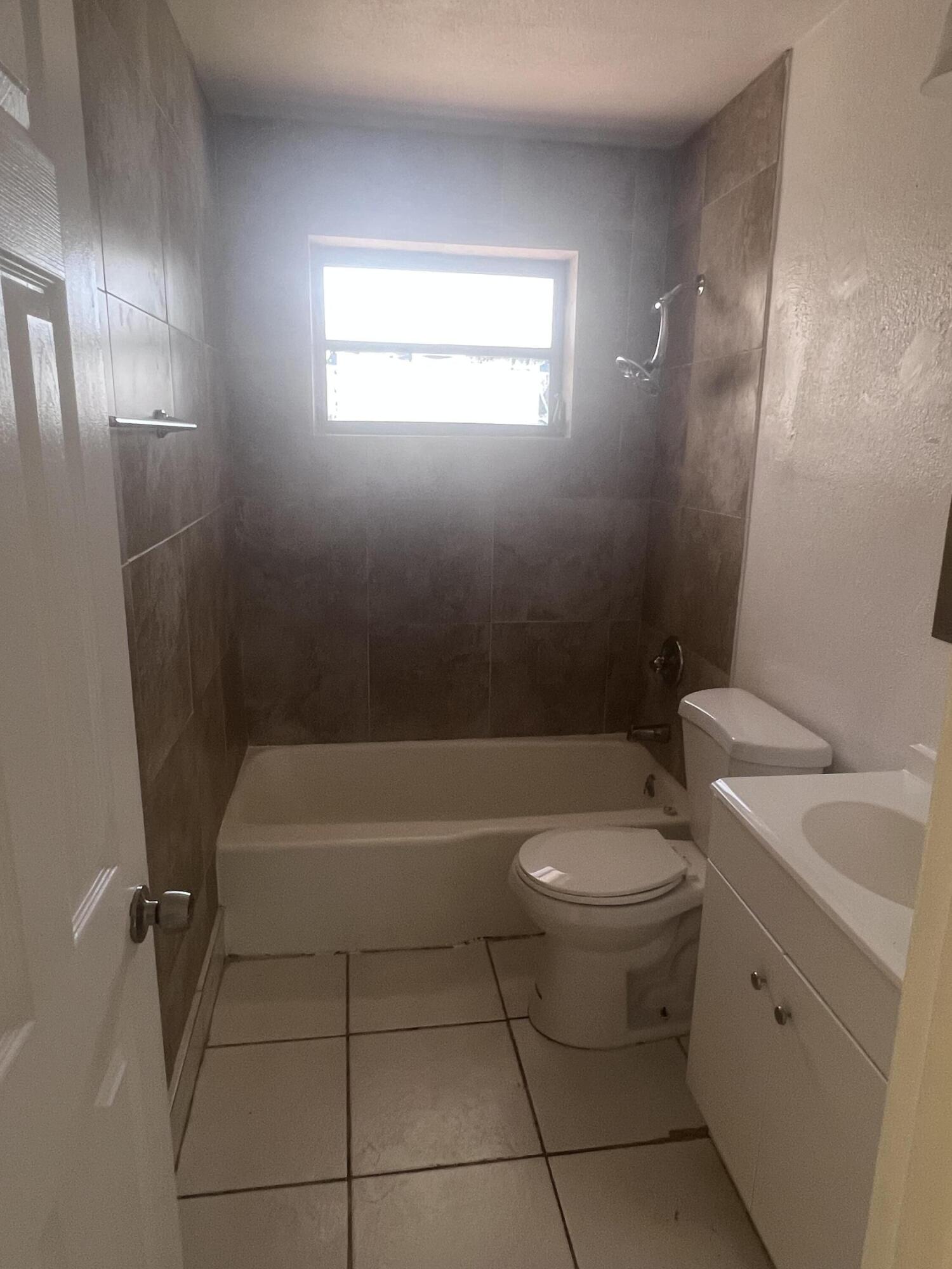 1530 Pine Tree Court Riviera Beach, FL 33404 - Photo 15 of 21 Guest Bathroom