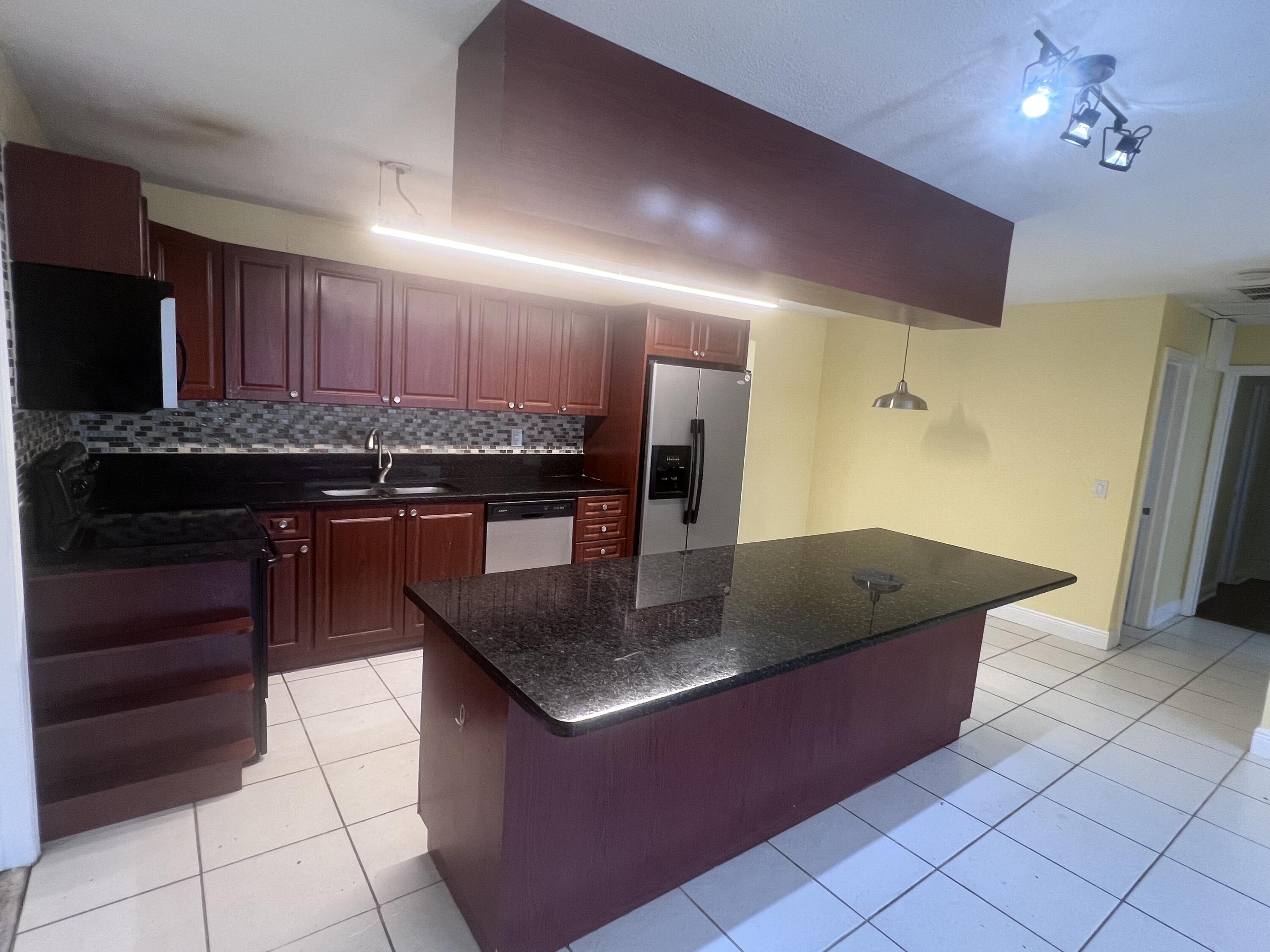 1530 Pine Tree Court Riviera Beach, FL 33404 - Photo 3 of 21 Super Kitchen