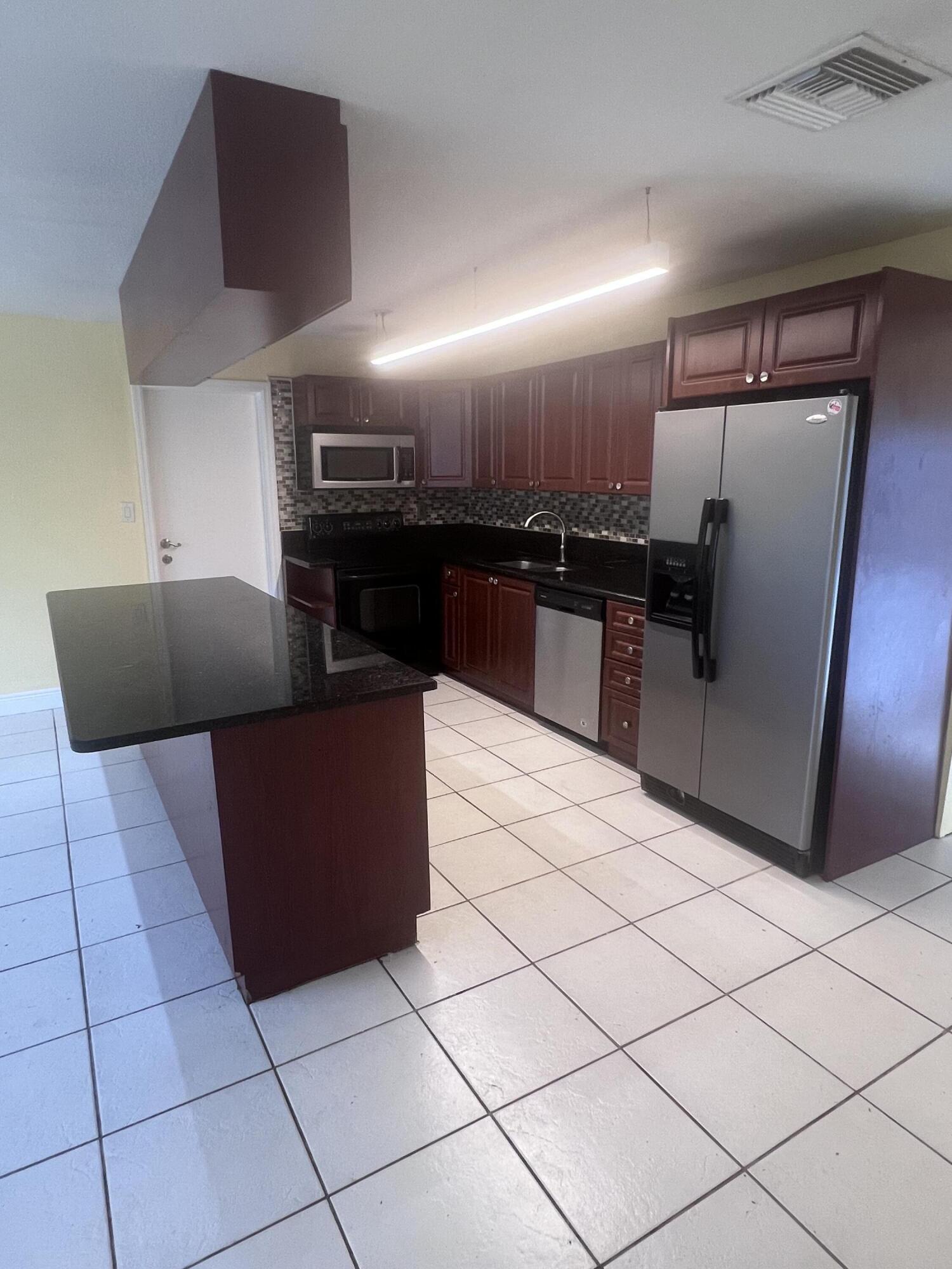 1530 Pine Tree Court Riviera Beach, FL 33404 - Photo 5 of 21 Kitchen