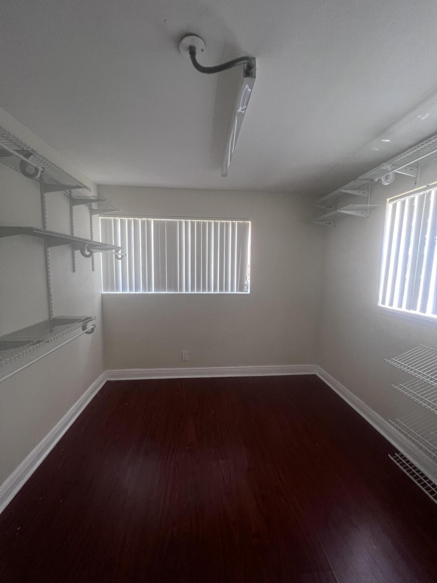 1530 Pine Tree Court Riviera Beach, FL 33404 - Photo 10 of 21 Master BR Walk-In Closet