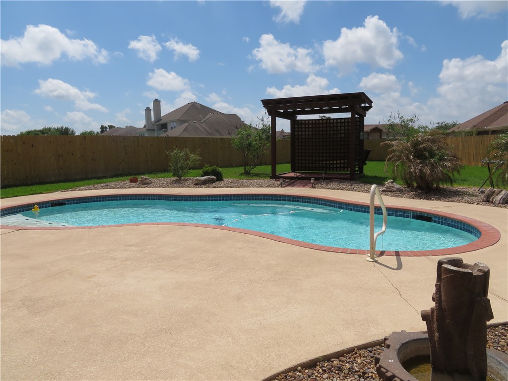 5803 South Oso Parkway Corpus Christi, TX 78414 - Photo 35 of 39 a house with swimming pool in front of it
