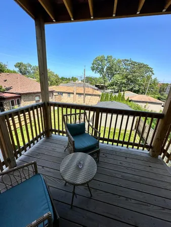 a view of a balcony with furniture