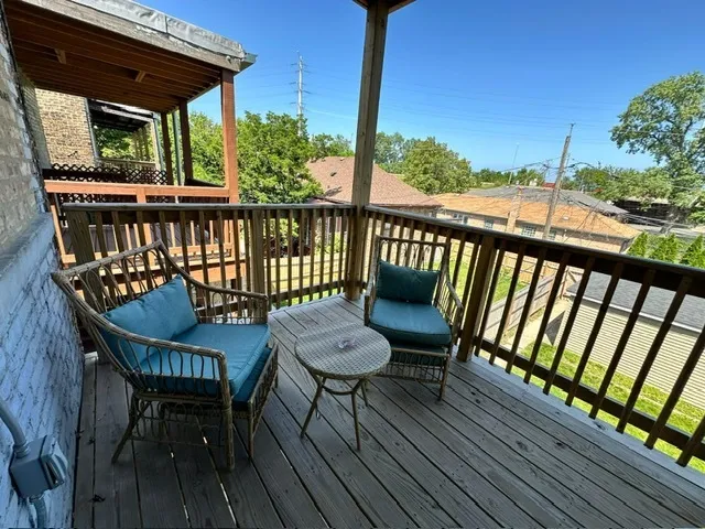 a view of a chairs on the roof deck