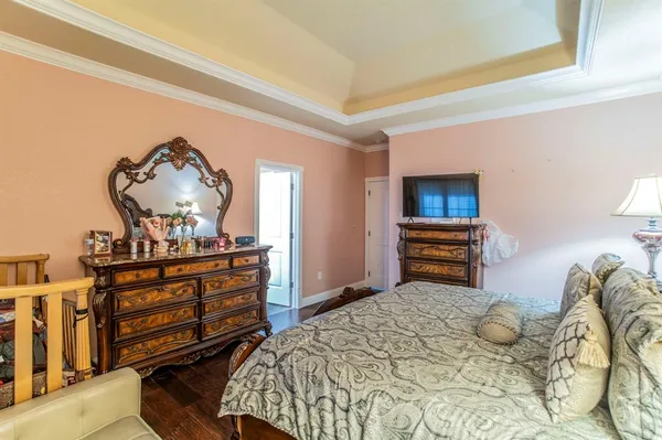 a bedroom with a bed and a dresser