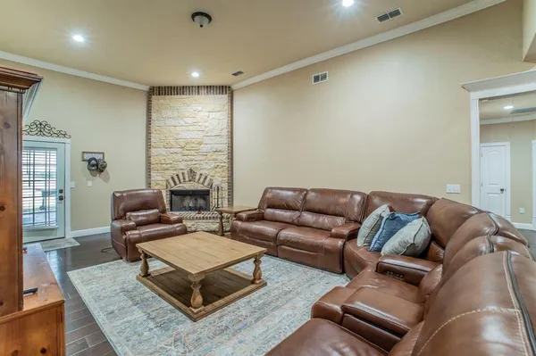 a living room with furniture a fireplace and a table
