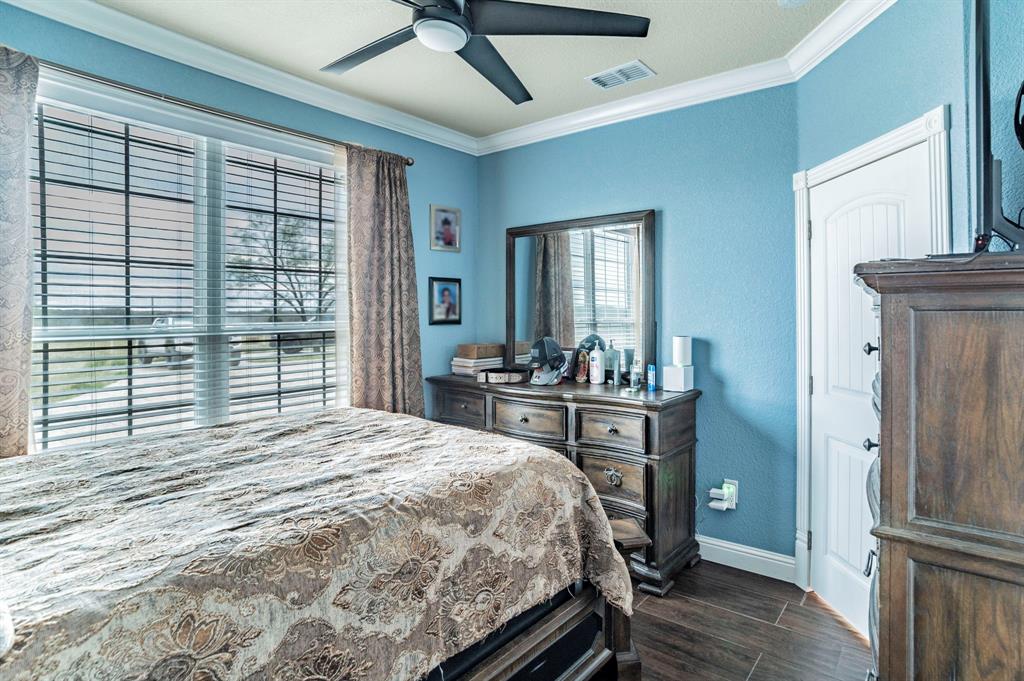 1019 Gin Road Ennis, TX 75119 - Photo 22 of 40 a bedroom with a bed and a table
