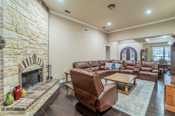 a living room with furniture fireplace and a fireplace