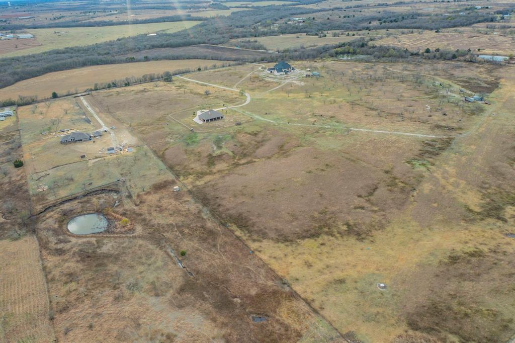 1019 Gin Road Ennis, TX 75119 - Photo 38 of 40 a view of a backyard of the house