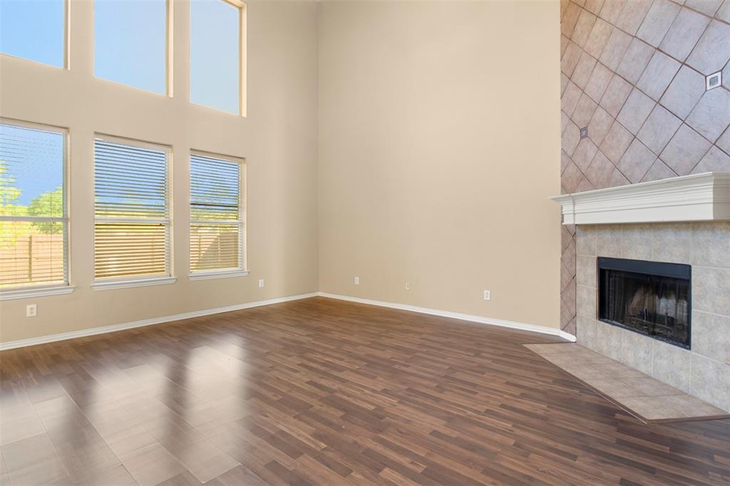 2113 Glen Manor Road Corinth, TX 76208 - Photo 12 of 36 Living room with a wall of windows