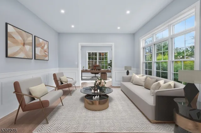 a large kitchen with stainless steel appliances kitchen island a large counter top and a stove top oven