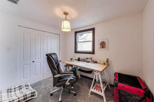 a view of a workspace with furniture