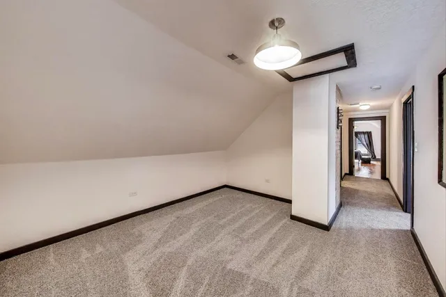 a room with gym equipment and a window