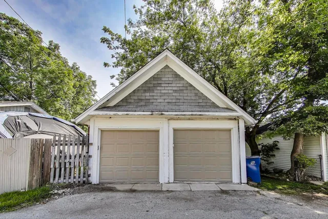 a picture of a bathroom with a shower a sink