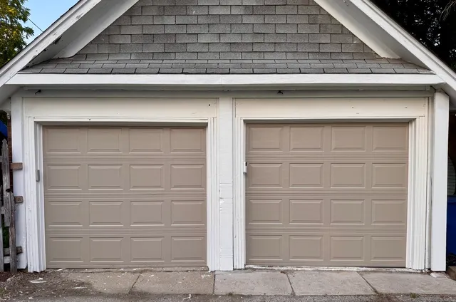 a hallway with a white wall