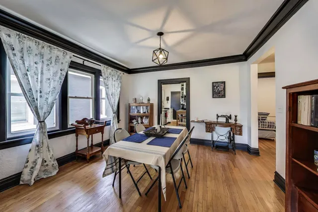 a workspace with furniture window and wooden floor