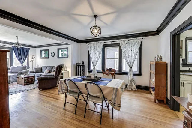 a view of a livingroom with furniture and a window