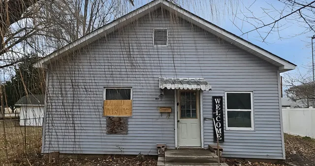 a front view of a house with garage