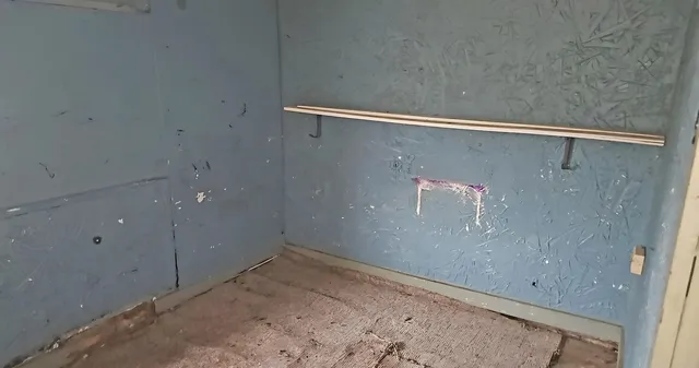 a bathroom with a granite countertop shower