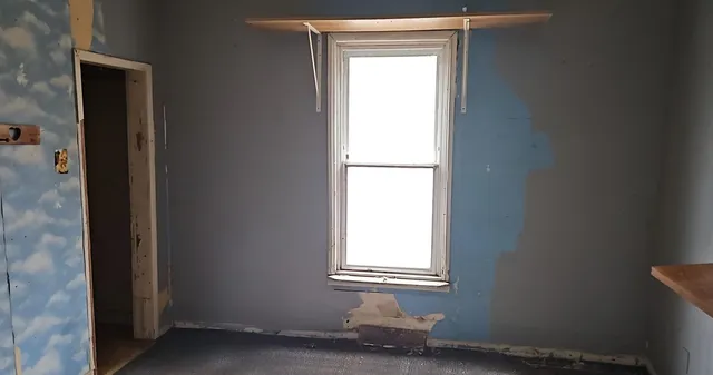 an empty room with a window