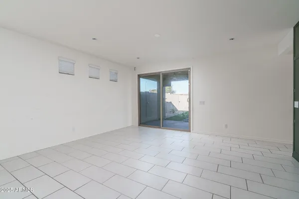 a view of an empty room and window