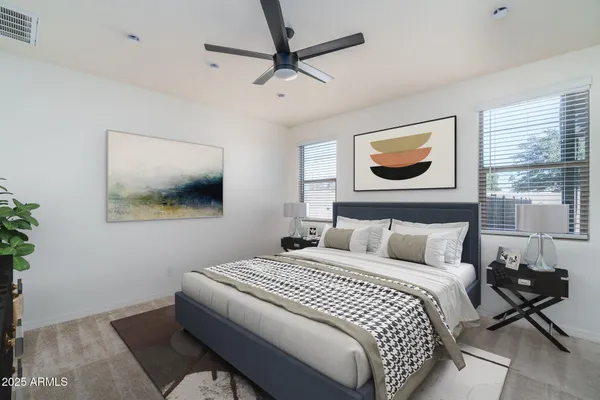 a living room with furniture and a dining area with kitchen view