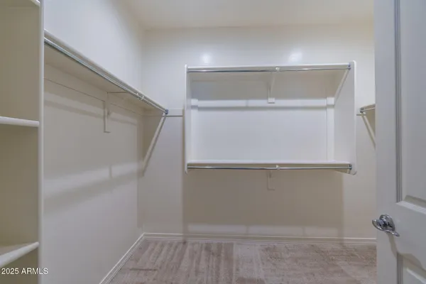 a bathroom with a granite countertop sink two mirror and a